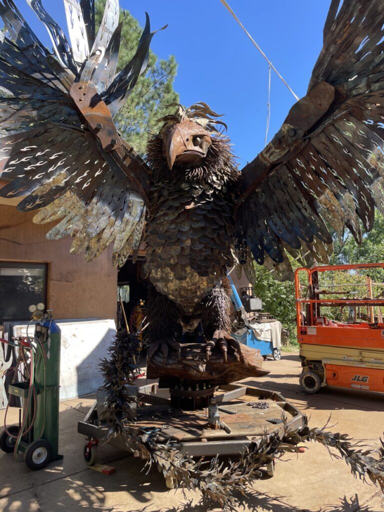large metal sculpture of a phoenix